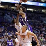 Sacramento Kings guard Ty Lawson (10) is fouled by Phoenix Suns center Alex Len (21) during the first half of an NBA basketball game, Wednesday, March 15, 2017, in Phoenix. (AP Photo/Matt York)