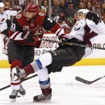 Arizona Coyotes defenseman Alex Goligoski (33) sends Colorado Avalanche center Joe Colborne, right, to the ice during the first period of an NHL hockey game, Monday, March 13, 2017, in Glendale, Ariz. (AP Photo/Ross D. Franklin)