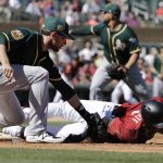 Arizona Diamondbacks' Ketel Marte is tagged out at first by Oakland Athletics' Yonder Alonso during the second inning of a spring training baseball game Tuesday, March 7, 2017, in Scottsdale, Ariz. (AP Photo/Darron Cummings)
