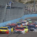 Pole sitter Joey Logano (22) and Ryan Blaney (21) lead the field past the green flag during the start of the NASCAR Cup Series auto race at Phoenix International Raceway, Sunday, March. 19, 2017, in Avondale, Ariz. (AP Photo/Ralph Freso)