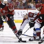 Colorado Avalanche left wing Gabriel Landeskog (92) battles with Arizona Coyotes right wing Tobias Rieder (8) and left wing Jordan Martinook (48) for the puck during the first period of an NHL hockey game, Monday, March 13, 2017, in Glendale, Ariz. (AP Photo/Ross D. Franklin)