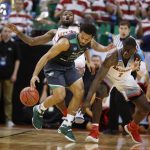 North Dakota guard Quinton Hooker (21) tries to control the ball as Arizona guards Rawle Alkins (1) and Kadeem Allen, back, defend during the first half of a first-round game in the NCAA men's college basketball tournament Thursday, March 16, 2017, in Salt Lake City. (AP Photo/George Frey)
