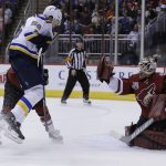 Arizona Coyotes goalie Louis Domingue (35) makes the save on St. Louis Blues left wing Magnus Paajarvi (56) in the first period during an NHL hockey game, Wednesday, March 29, 2017, in Glendale, Ariz. (AP Photo/Rick Scuteri)
