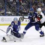 Tampa Bay Lightning goalie Andrei Vasilevskiy (88) makes a save on a shot as defenseman Anton Stralman (6) keeps Arizona Coyotes center Christian Dvorak (18) from a rebound during the first period of an NHL hockey game Tuesday, March 21, 2017, in Tampa, Fla. (AP Photo/Chris O'Meara)