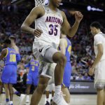 Arizona's Allonzo Trier reacts after a play against UCLA during the first half of an NCAA college basketball game in the semifinals of the Pac-12 men's tournament Friday, March 10, 2017, in Las Vegas. (AP Photo/John Locher)