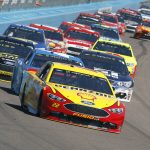 Joey Logano (22) leads the field into Turn 1 during the NASCAR Cup Series auto race at Phoenix International Raceway, Sunday, March. 19, 2017, in Avondale, Ariz. (AP Photo/Ralph Freso)