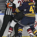 NHL referee Graham Skilliter (24) collides with Buffalo Sabres Zach Bogosian (47) and Arizona Coyotes Brendan Perlini (29) during the second period of an NHL hockey game, Thursday, March. 2, 2017, in Buffalo, N.Y. (AP Photo/Jeffrey T. Barnes)