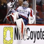 Washington Capitals goalie Philipp Grubauer climbs over the boards to replace Braden Holtby after Holtby gave up three goals against the Arizona Coyotes during the first period of an NHL hockey game Friday, March 31, 2017, in Glendale, Ariz.  The Capitals' Holtby would come back into the game for the second period. (AP Photo/Ross D. Franklin)
