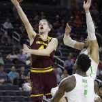 Arizona State's Kodi Justice, left, shoots around Oregon's Dillon Brooks, right, during the second half of an NCAA college basketball game in the quarterfinals of the Pac-12 men's tournament Thursday, March 9, 2017, in Las Vegas. (AP Photo/John Locher)