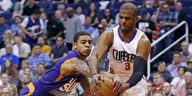 LA Clippers' Chris Paul (3) controls the ball as Phoenix Suns' Tyler Ulis, left, tries to strip it ...