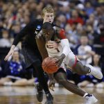 Xavier guard J.P. Macura, left, defends on Arizona guard Rawle Alkins (1) during the first half of an NCAA Tournament college basketball regional semifinal game Thursday, March 23, 2017, in San Jose, Calif. (AP Photo/Tony Avelar)