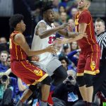 Southern California's Elijah Stewart (30) and Nick Rakocevic (31) combine to strip the ball away from SMU's Semi Ojeleye (33) in the second half of a first-round game in the men's NCAA college basketball tournament in Tulsa, Okla., Friday March 17, 2017. (AP Photo/Tony Gutierrez)