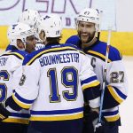 St. Louis Blues defenseman Alex Pietrangelo (27) smiles as he celebrates his goal against the Arizona Coyotes with defenseman Jay Bouwmeester (19) and center Paul Stastny, left, during the first period of an NHL hockey game Saturday, March 18, 2017, in Glendale, Ariz. (AP Photo/Ross D. Franklin)