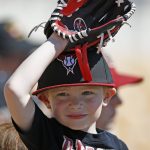 A young Arizona Diamondbacks fan watches players warm up prior to a spring training baseball game against the Chicago White Sox Thursday, March 9, 2017, in Glendale, Ariz. (AP Photo/Ross D. Franklin)