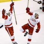 Detroit Red Wings center Dylan Larkin, right, celebrates his goal against the Arizona Coyotes with center Andreas Athanasiou, left, during the first period of an NHL hockey game Thursday, March 16, 2017, in Glendale, Ariz. (AP Photo/Ross D. Franklin)