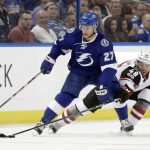 Arizona Coyotes left wing Jordan Martinook (48) knocks the puck away from Tampa Bay Lightning left wing Jonathan Drouin (27) during the first period of an NHL hockey game Tuesday, March 21, 2017, in Tampa, Fla. (AP Photo/Chris O'Meara)