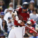 Arizona Diamondbacks' Jake Lamb starts his swing on a two-run home run against the Chicago Cubs during the first inning of a spring training baseball game Thursday, March 23, 2017, in Scottsdale, Ariz. (AP Photo/Ross D. Franklin)