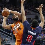 Phoenix Suns forward Alan Williams (15) is fouled by Detroit Pistons center Andre Drummond (0) in the first half of an NBA basketball game in Auburn Hills, Mich., Sunday, March 19, 2017. (AP Photo/Paul Sancya)