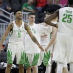 Oregon's Tyler Dorsey (5) celebrates with teammates after defeating Arizona State in an NCAA college basketball game in the quarterfinals of the Pac-12 men's tournament Thursday, March 9, 2017, in Las Vegas. Oregon won 80-57. (AP Photo/John Locher)
