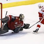 Detroit Red Wings right wing Gustav Nyquist (14) scores a goal against Arizona Coyotes goalie Mike Smith (41) during the shootout of an NHL hockey game Thursday, March 16, 2017, in Glendale, Ariz. The Red Wings defeated the Coyotes 5-4. (AP Photo/Ross D. Franklin)