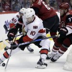 Ottawa Senators left wing Tom Pyatt (10) shields Arizona Coyotes defenseman Anthony DeAngelo (77) from the puck during the first period of an NHL hockey game, Thursday, March 9, 2017, in Glendale, Ariz. (AP Photo/Rick Scuteri)