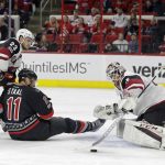 Carolina Hurricanes' Jordan Staal (11) tries to score while Arizona Coyotes' Oliver Ekman-Larsson (23), of Sweden, and goalie Louis Domingue defend during the second period of an NHL hockey game in Raleigh, N.C., Friday, March 3, 2017. (AP Photo/Gerry Broome)