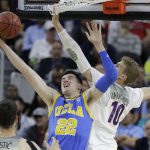 UCLA's TJ Leaf shoots against Arizona's Lauri Markkanen during the first half of an NCAA college basketball game in the semifinals of the Pac-12 men's tournament Friday, March 10, 2017, in Las Vegas. (AP Photo/John Locher)