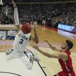 Villanova guard Josh Hart (3) loses control of the ball while driving to the basket against Wisconsin guard Zak Showalter (3) during the first half of a second-round men's college basketball game in the NCAA Tournament, Saturday, March 18, 2017, in Buffalo, N.Y. (AP Photo/Bill Wippert)