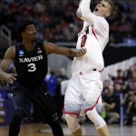 Arizona forward Lauri Markkanen (10) is defended by Xavier guard Quentin Goodin (3) during the second half of an NCAA Tournament college basketball regional semifinal game Thursday, March 23, 2017, in San Jose, Calif. (AP Photo/Tony Avelar)