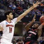 Jacksonville State's Tyrik Edwards (4) heads to the basket as Louisville's Anas Mahmoud (14) defends during the second half of a first-round game in the men's NCAA college basketball tournament Friday, March 17, 2017, in Indianapolis, Mo. Louisville won 78-63. (AP Photo/Jeff Roberson)