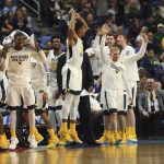 West Virginia players celebrate in the closing moments of their 83-71 win against Notre Dame in a second-round men's college basketball game in the NCAA Tournament, Saturday, March 18, 2017, in Buffalo, N.Y. (AP Photo/Bill Wippert)