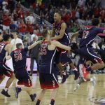 Arizona players celebrate after defeating Oregon in an NCAA college basketball game in the championship of the Pac-12 men's tournament Saturday, March 11, 2017, in Las Vegas. Arizona won 83-80. (AP Photo/John Locher)