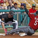 Arizona Diamondbacks' Gregor Blanco (5) gets tagged out at third base by Chicago White Sox third baseman Matt Davidson, left, as Blanco tried to stretch a double into a triple during the third inning of a spring training baseball game Thursday, March 9, 2017, in Glendale, Ariz. (AP Photo/Ross D. Franklin)