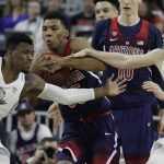 Arizona's Allonzo Trier, center, competes for the ball with Oregon's Dylan Ennis, left, and Casey Benson during the first half of an NCAA college basketball game for the championship of the Pac-12 men's tournament Saturday, March 11, 2017, in Las Vegas. (AP Photo/John Locher)