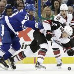 Arizona Coyotes defenseman Jakob Chychrun (6) gets knocked down by Tampa Bay Lightning defenseman Luke Witkowski (28) during the first period of an NHL hockey game Tuesday, March 21, 2017, in Tampa, Fla. Witkowski was called for cross-checking. (AP Photo/Chris O'Meara)