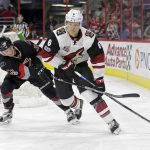 Carolina Hurricanes' Derek Ryan (33) chases Arizona Coyotes' Jakob Chychrun (6) during the second period of an NHL hockey game in Raleigh, N.C., Friday, March 3, 2017. (AP Photo/Gerry Broome)