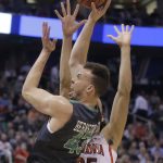 North Dakota forward Drick Bernstine (43) shoots as Arizona forward Keanu Pinder (25) defends during the first half of a first-round game in the NCAA men's college basketball tournament Thursday, March 16, 2017, in Salt Lake City. (AP Photo/Rick Bowmer)