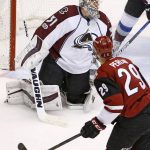 Arizona Coyotes left wing Brendan Perlini (29) scores a goal against Colorado Avalanche goalie Calvin Pickard (31) during the second period of an NHL hockey game, Monday, March 13, 2017, in Glendale, Ariz. (AP Photo/Ross D. Franklin)