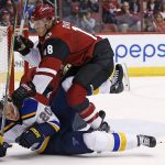 Arizona Coyotes center Christian Dvorak (18) checks St. Louis Blues left wing Alexander Steen (20) to the ice during the second period of an NHL hockey game Saturday, March 18, 2017, in Glendale, Ariz. (AP Photo/Ross D. Franklin)