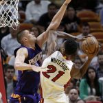Miami Heat's Hassan Whiteside (21) attempts a basket as Phoenix Suns' Alex Len defends during the first half of an NBA basketball game, Tuesday, March 21, 2017, in Miami. (AP Photo/Lynne Sladky)