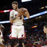Miami Heat's Tyler Johnson (8) grabs a rebound during the first half of an NBA basketball game against the Phoenix Suns, Tuesday, March 21, 2017, in Miami. (AP Photo/Lynne Sladky)