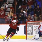 Arizona Coyotes' Alexander Burmistrov (91) celebrates his goal against Washington Capitals' Braden Holtby, right, during the first period of an NHL hockey game Friday, March 31, 2017, in Glendale, Ariz. (AP Photo/Ross D. Franklin)