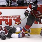 Arizona Coyotes defenseman Luke Schenn (2) checks Colorado Avalanche right wing Sven Andrighetto (10) to the ice during the second period of an NHL hockey game Monday, March 13, 2017, in Glendale, Ariz. (AP Photo/Ross D. Franklin)