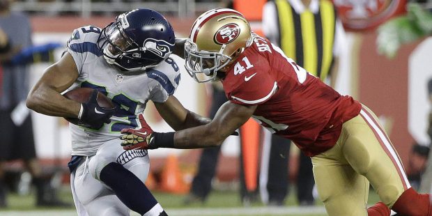 San Francisco 49ers strong safety Antoine Bethea (41) tackles Seattle Seahawks wide receiver Doug B...