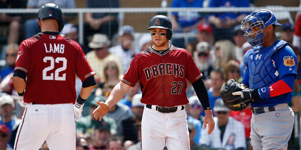 Arizona Diamondbacks' Brandon Drury (27) extends his arm to shake hands with Jake Lamb (22) after L...