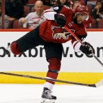 Arizona Coyotes' Anthony Duclair, right, shoots the puck as Carolina Hurricanes' Jordan Staal defends during the second period of an NHL hockey game, Sunday, March 5, 2017, in Glendale, Ariz. The Hurricanes won 2-1. (AP Photo/Ralph Freso)