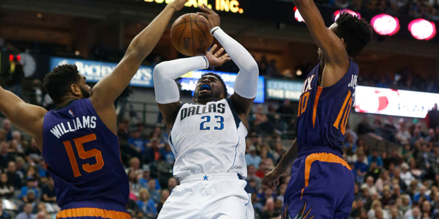 Dallas Mavericks guard Wesley Matthews (23) is fouled by Phoenix Suns forward Alan Williams (15) as...