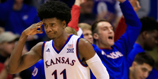 Kansas guard Josh Jackson (11) salutes his teammates after a three-point basket during the second h...