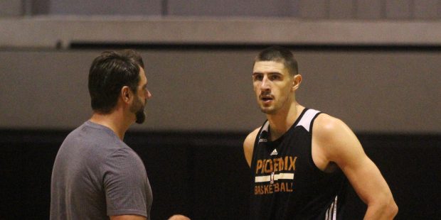 Phoenix Suns center Alex Len talks with player development coach Mehmet Okur during practice on Tue...