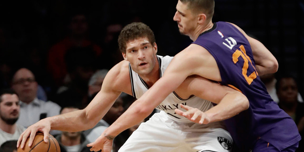 Phoenix Suns' Alex Len, right, defends Brooklyn Nets' Brook Lopez during the second half of an NBA ...